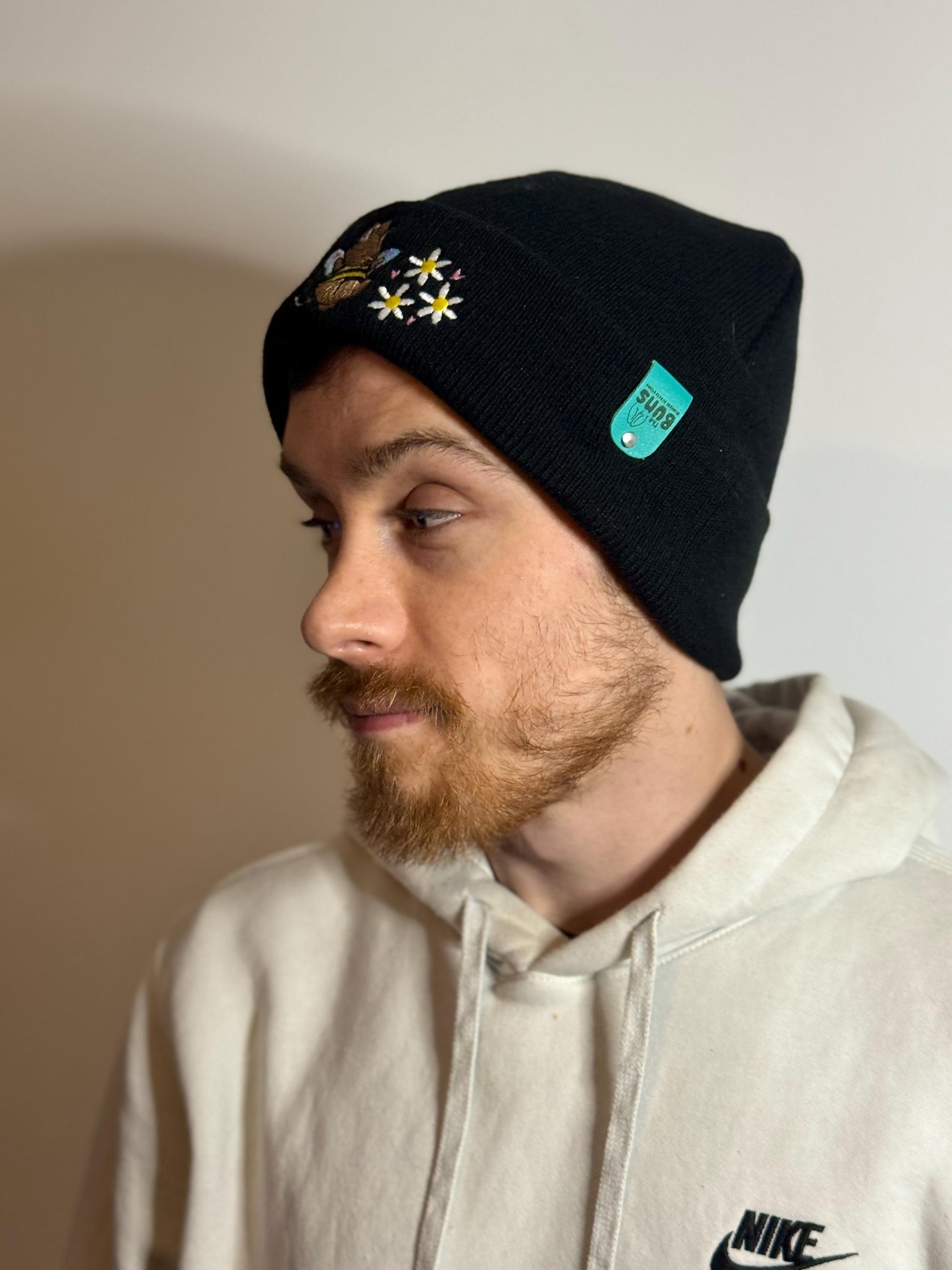 aborable THE BUNS (c) kawaii art rabbit cute spring bee bumble bun embroidered thermal hat black beanie featuring daisies