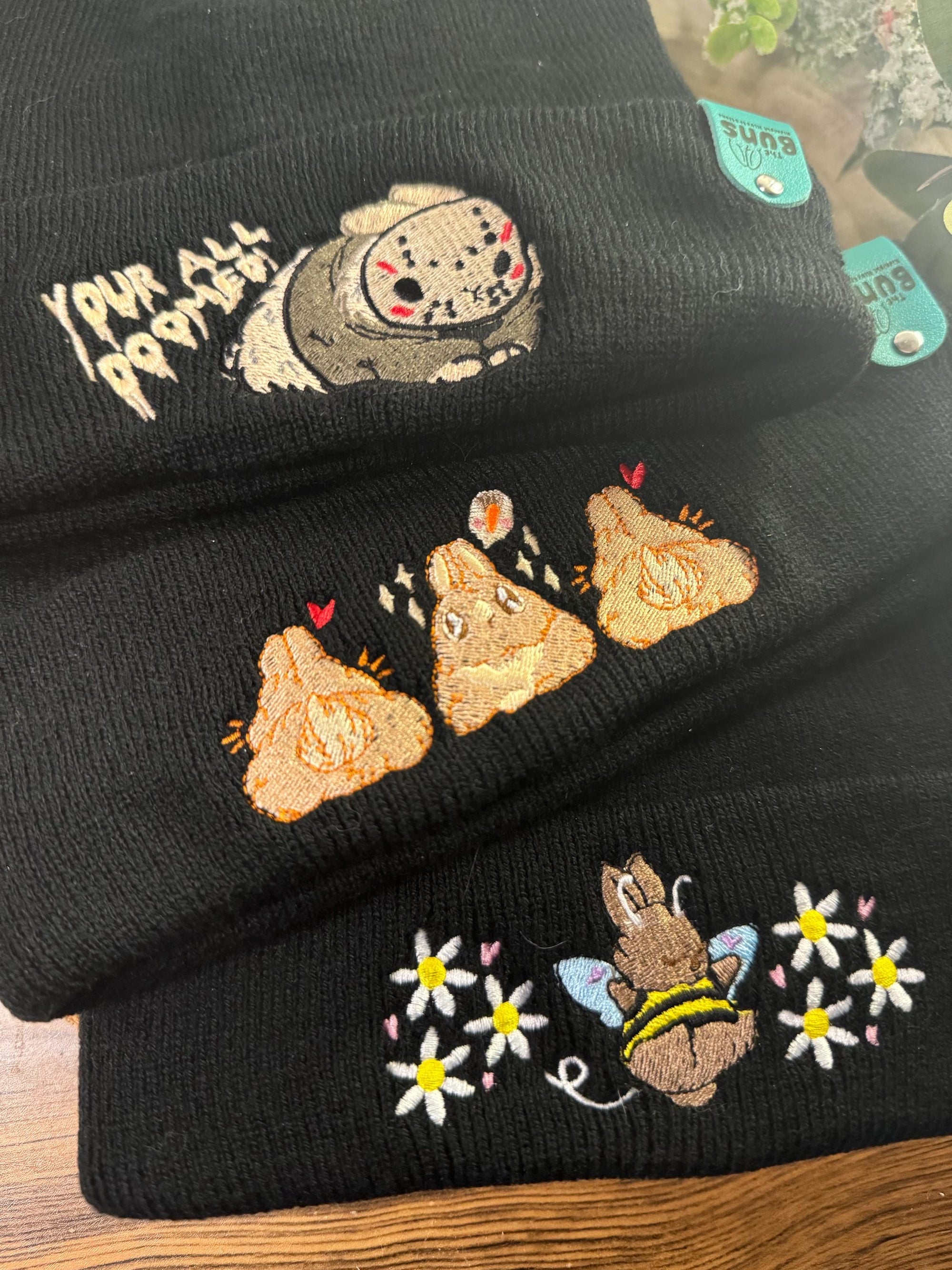 aborable THE BUNS (c) kawaii art rabbit cute spring bee bumble bun embroidered thermal hat black beanie featuring daisies