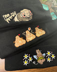 aborable THE BUNS (c) kawaii art rabbit cute spring bee bumble bun embroidered thermal hat black beanie featuring daisies