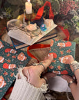THE BUNS (c) adorable cute Christmas rabbits gift wrap wrapping paper in traditional holiday colours with buns in Santa hats and stockings
