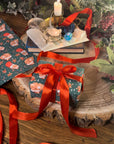 THE BUNS (c) adorable cute Christmas rabbits gift wrap wrapping paper in traditional holiday colours with buns in Santa hats and stockings