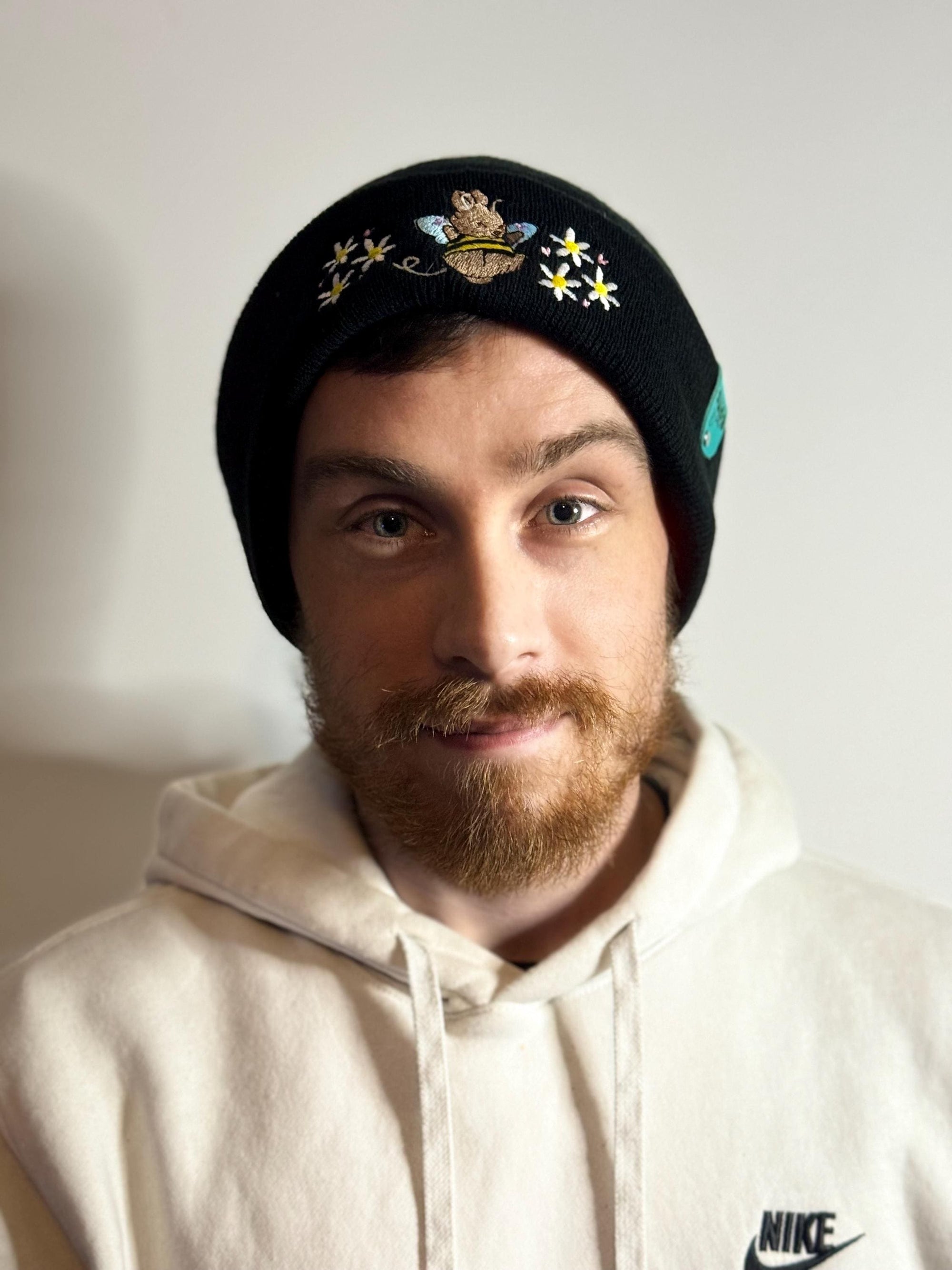 aborable THE BUNS (c) kawaii art rabbit cute spring bee bumble bun embroidered thermal hat black beanie featuring daisies